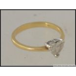 An 18ct gold and diamond single stone heart shaped ring.
