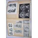 An early 20th century decoupage scrap album consisting of many magazine cutouts of antiques -