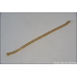 A ladies 9ct gold / 375 marked bracelet of Omega linked form having clasp. Measures 19.5cms long.