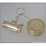 A vintage Houbigant of France Art Deco gilt metal Powder Compact and telescopic lipstick holder