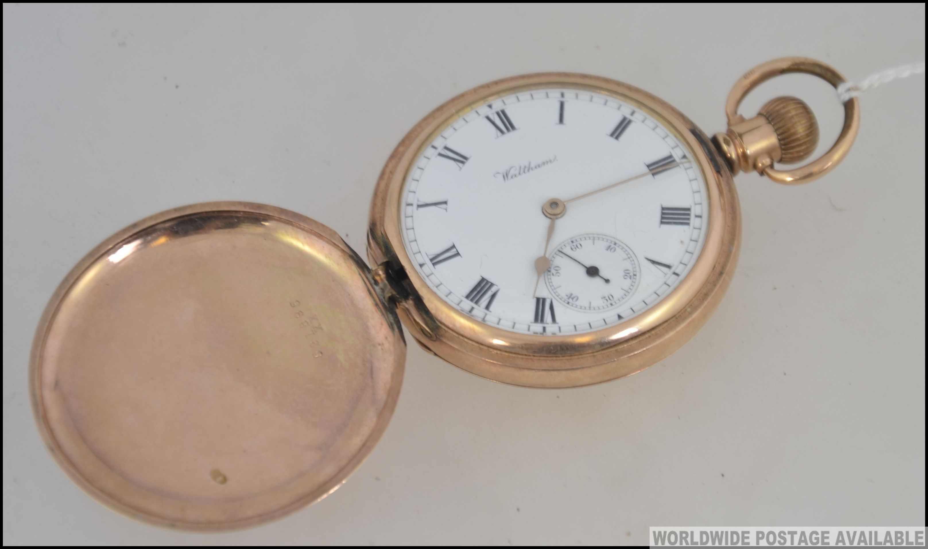 A 20th century Waltham hunter pocket watch in gold plated case with subsiduary seconds dial,