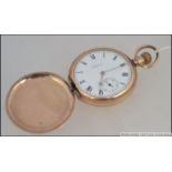 A 20th century Waltham hunter pocket watch in gold plated case with subsiduary seconds dial,