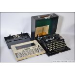 A Vintage Imperial cased typewriter along with a retro Silver Reed cased typewriter