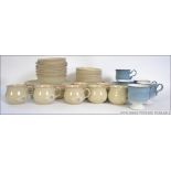A part dinner and tea service by Denby to include dinner plates, side plates, cups,