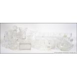 An extensive collection of cut glass crystal to include decanters, wine glasses, vases etc.