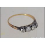 A vintage 18ct gold and 5 stone diamond ring.