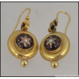 A pair of 9ct gold, ruby garnet stone and seed pearl ladies earrings complete with hoops,