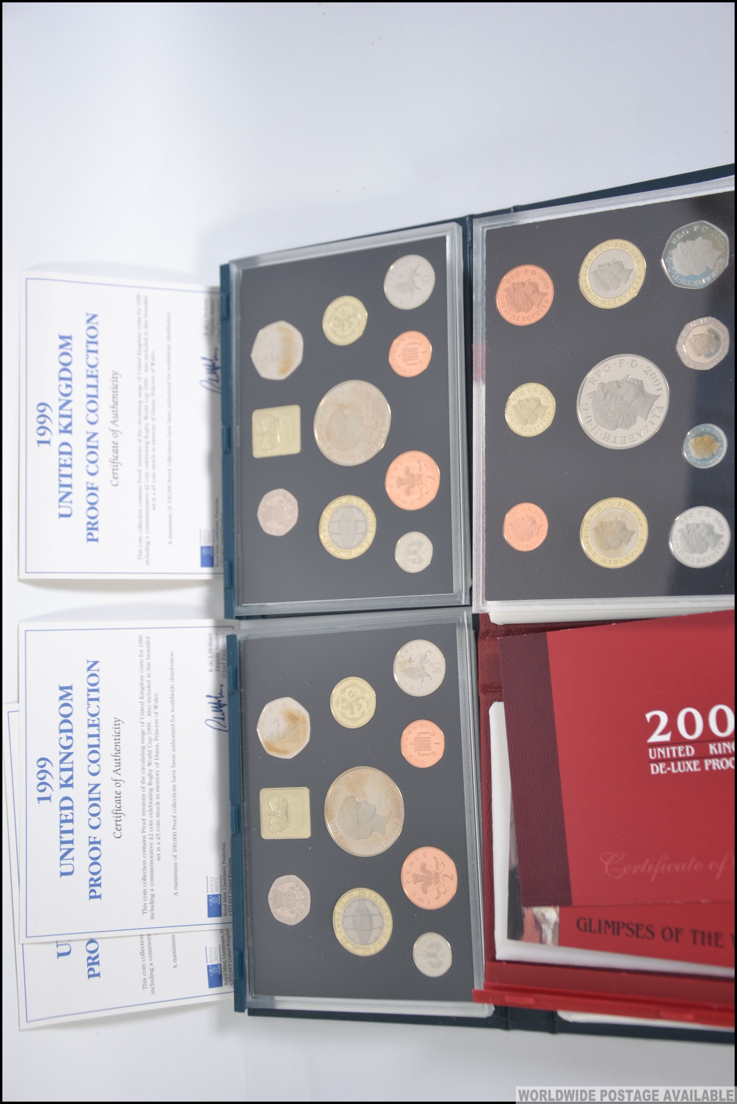 A collection of 3 United Kingdom proof coin sets 1999 x 2 and a 2001 de-lux proof set all with