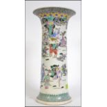 A 19th century Chinese famille rose tall cylindrical gu vase decorated with scenes of mystical