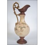 A 19th century Moore & Co Folyian ware Ivory Blush vase jug with scrolled handle and marks to the