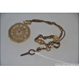An 18ct gold ladies pocket fob watch, the watch with roman numeral chapter ring,