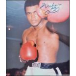 A personally signed colour photograph of Mohammed Ali being complete with the Certificate of