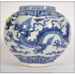 A large blue and white Chinese Kang-xi ribbed bowl vase with scenes of birds and trees etc.