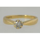 A 9ct gold and diamond single stone ladies ring.