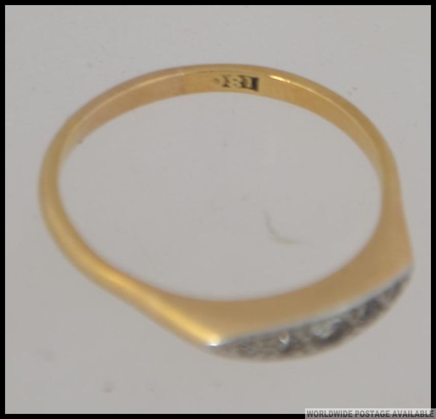 An 18ct gold and diamond ring being illusion set with 5 stones of graduating size approx 10-12 pnts. - Image 3 of 3