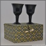 A stunning pair of Chinese black jade miniature goblets.