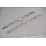 A Sterling Silver ladies Rotary wristwatch with silver bracelet of abstract form together with a