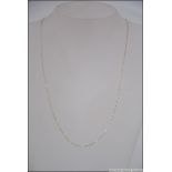 A 9ct gold bar linked necklace measuring 52cms long. 0.