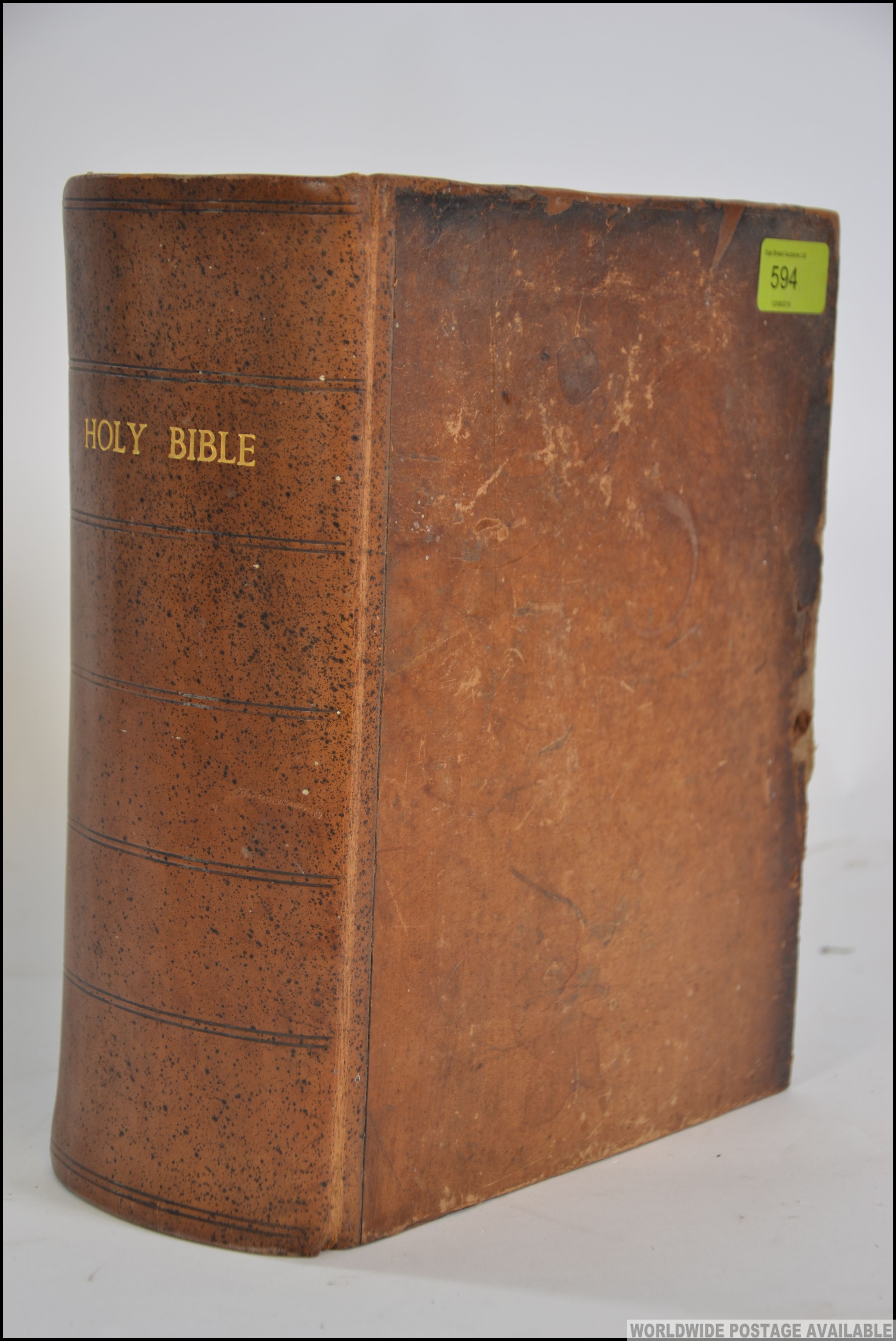 A large Holy Bible being leather bound - Old and New Testaments by The Reverend Matthew Hendy -