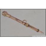A 9ct gold 19th century propelling pencil with rococo chase decoration. Total weight 3.