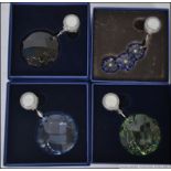 A set of 4 Swarovski crystal glass drea