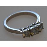 A hallmarked 18ct gold 3 stone diamond r