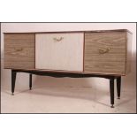 A 1950's retro melamine sideboard raised