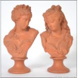 A pair of 19th / 20th century clay figur