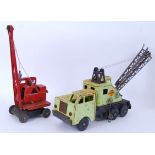 CRANES: Two vintage tinplate toy cranes.