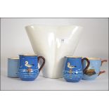 A collection of Torquay ware pottery to include seagull decorated cups along with a studio