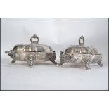 A pair of early 20th century silver plated on copper bacon warmers,