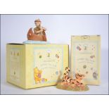 A Royal Doulton Winnie The Pooh figurine complete in the box.