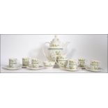 A Royal Doulton 6 person coffee service in the Tonkin TC 1107 pattern to include 6 coffee cans and