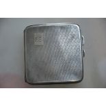 A silver hallmarked cigarette case having an engine turned geometric pattern,