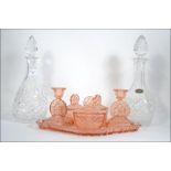 A Victorian peach glass dressing table set together with a pair of cut glass decanters H21cm