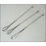 3 silver cocktail twizzle sticks, unmarked. Total weight 14.