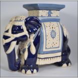 A large floor standing ceramic plant stand in the form of an Indian elephant H44cm