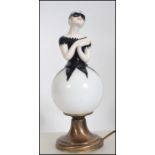 A stunning chintzy vintage French over painted glass table lamp in the form of a female pierrot