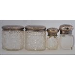 A collection of 4 silver hallmarked dressing table pots,