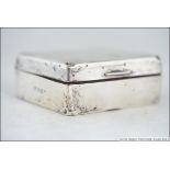 A silver hallmarked table top cigarette case by William Neale & Sons Ltd,