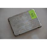A silver hallmarked cigarette case having an engine turned geometric pattern,