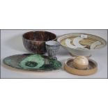 A good selection of studio pottery by various different makers to include bowls, vase,