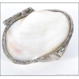 A silver white metal and mother of pearl purse,