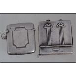 A vintage silver metal advertising match book holder for Hyde Park Hotel along with a silver