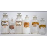 A good group of 19th Century chemist / apothecary glass bottles retaining original labels.