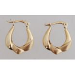 A pair of 14ct gold creole earrings with