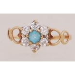 A 9ct gold cluster ring set with CZ and central blue stone. Marked 375 Optima CZ 9ct. Tests 9ct.