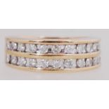 A 9ct gold and diamond band ring set wit