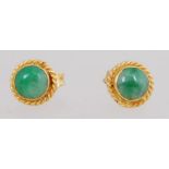 A pair of 18ct gold earrings set with gr