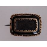 A 19th century mourning brooch with C cl